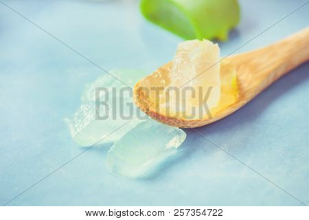 Aloe Vera Extract In A Small Bottle And Pieces On The Table. Selective Focus.