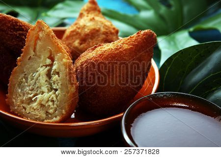 Coxinha Street Food. Brazilian Chicken Coxinha Over Rustic Background.