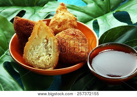 Coxinha Street Food. Brazilian Chicken Coxinha Over Rustic Background.