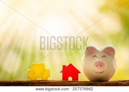 A House And Car Model And Piggy Bank For Loan Or Saving Money To Buy A New Real Estate And Chattel F