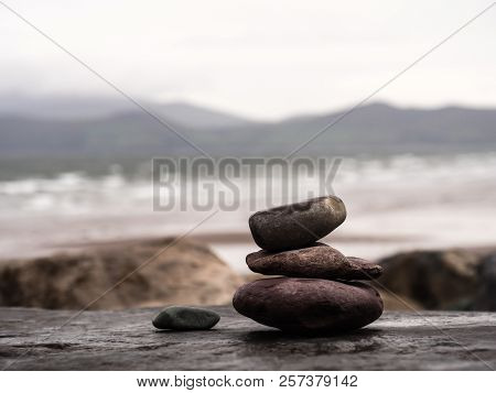 Stone Pyramide At Rossbeigh Beach In Ireland On A Rainy Day