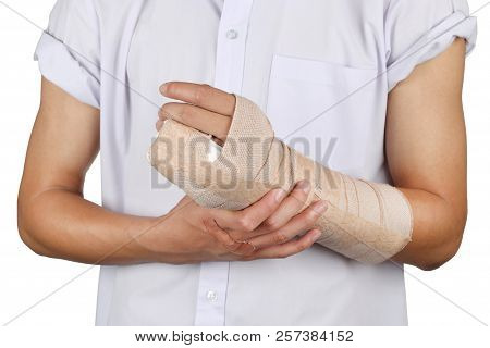 Close Up Of Young Asian Boy With Arm Plaster Fiberglass Cast Covering The Wrist Finger And Arm. Stud