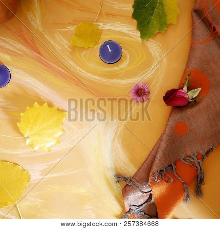 Yellow Leaves, Orange Tippet, Candles On Toned Paper Painted With Pastel, Top View, Concept Of Autum