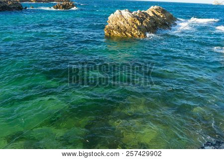 Summer, Rocks on the beach. Dramatic view of rocky coastline in Santander, Spain.