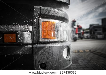 Pressure Washing Of Euro Semi Truck Closeup Photo. Trucking Theme.