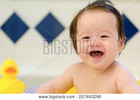 Baby Boy Taking A Bath In A Big Bath Tub