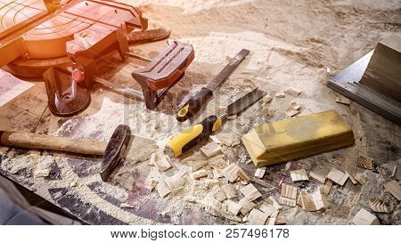 Topl View Of Carpenter Tools:hammer,meter,nails,shavings, And Chisel  Equipment Set On Wooden Table