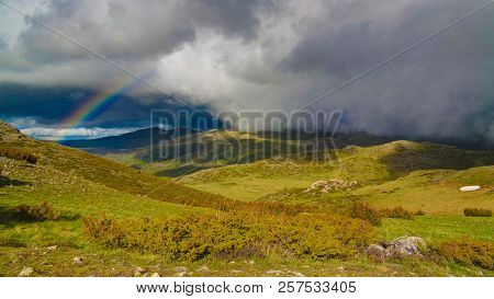Landscape Of Mavrovo National Park With Rainbow, Mountain And Lake In Fyr Macedonia