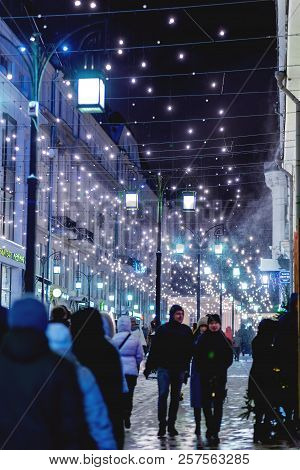 Moscow, Russia - Decembar 24, 2017. People Walking On Streets Of Moscow, Decorated To Celebrate The 