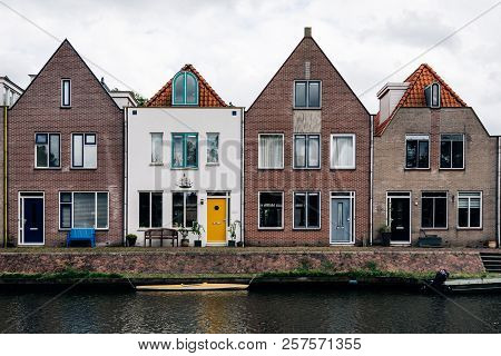 Scenic View Of Canal And Row Houses In The Netherlands