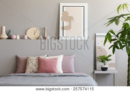 Pastel Sheets And Cushions Placed On Double Bed In Real Photo Of Bedroom Interior With Paintings, Ha