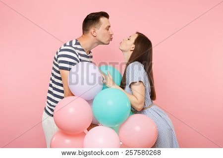 Portrait Of Young Happy Kissing Couple In Love. Woman And Man In Blue Clothes Celebrating Birthday H