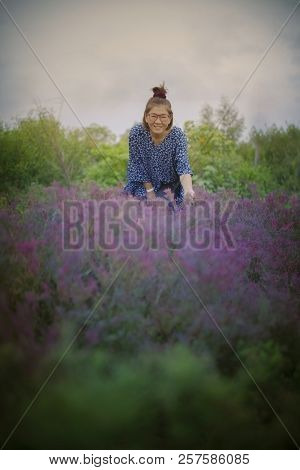 Asian Woman And Seashore Leaves In Sea Coast Wetland