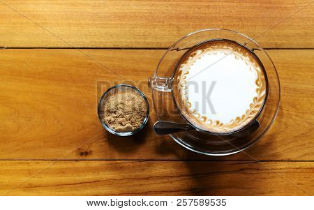 Hot Coffee Cup With Cane Sugar On The Wooden Table