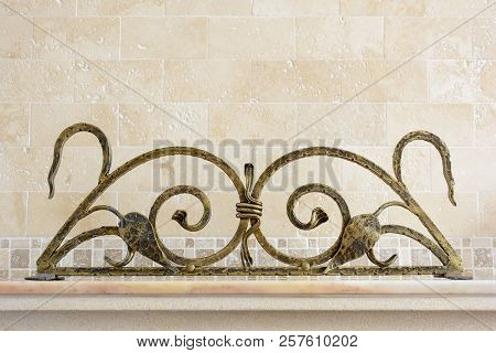 Wrought Iron Ornamental Grate For The Fireplace. Decorative Detail Of Metal Lattice For Interior.