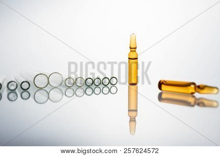 Group Of Vials With Medication On Blue Methacrylate Table. Horizontal Composition.
