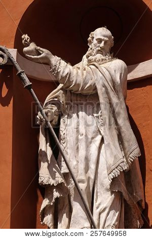 MODENA, ITALY - JUNE 04: Saint Barnabas statue on the portal of St. Barbabas Church, Italy on June 04, 2017.