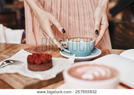 Cup Of Coffee Latte And Sweet Pastry On Wooden Table In Woman Hands. Gentle Romantic Mood, Girl Wear