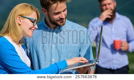 Workaholics Concept. Couple Works Despite Of Coffee Break. Colleagues With Laptop Work Outdoor Sunny