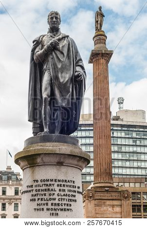 Glasgow, Scotland, Uk - June 17, 2012: Closeup Of  Greenish Bronze John Moore Statue On Stone Pedest