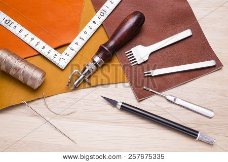 Leather Craft Tools And Leathers On A Wood Table