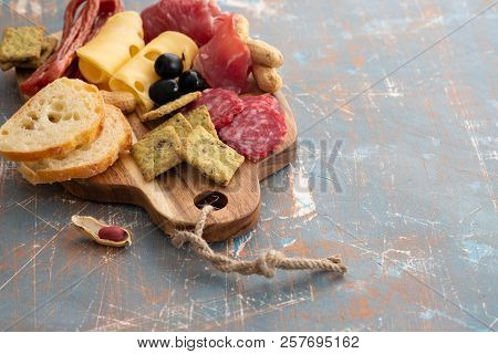 Platter With Spanish Ham Jamon Or Italian Prosciutto Crudo, Sliced Italian Hard Cheese. Homemade Dri