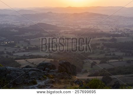 Sunset At The Morvan In France With Hills And Small Villages.