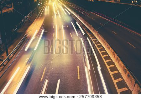Night Car City Raffic. Motion Blur Car On The Highway In Big Modern City.