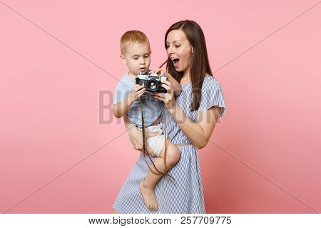 Portrait Of Happy Family. Mother Keep In Arms, Have Fun, Hug Son Baby Boy, Take Picture On Retro Vin