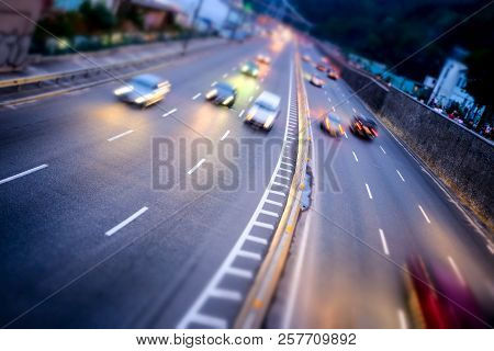 Night Car City Raffic. Motion Blur Car On The Highway In Big Modern City.