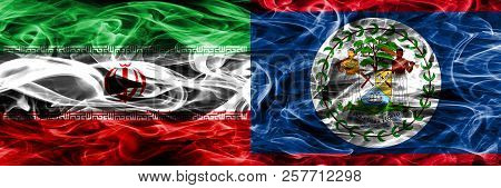 Iran Vs Belize Smoke Flags Placed Side By Side. Thick Colored Silky Smoke Flags Of Iranian And Beliz