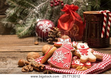 Gingerbread Cookies Over Old Wooden Background. Christmas New Year Holiday Decoration. Copy Space.