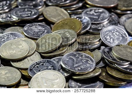 Russian Banknotes And Coins. A Handful Of Coins On New Russian Banknotes In Denominations Of 2000 An
