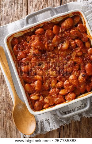Serbian Food: Prebranac Baked Beans With Onion Close-up In Baking Dish. Vertical Top View From Above
