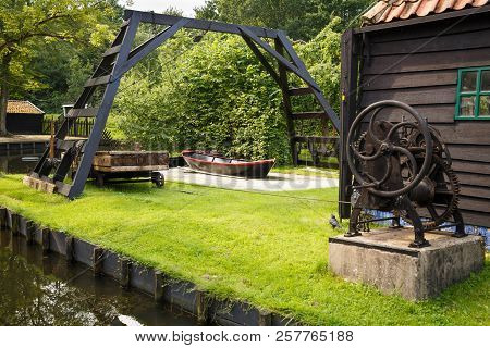 The Houses At The Canal And Old Mechanism In The Traditional Old Fisherman Village Open-air Museum O
