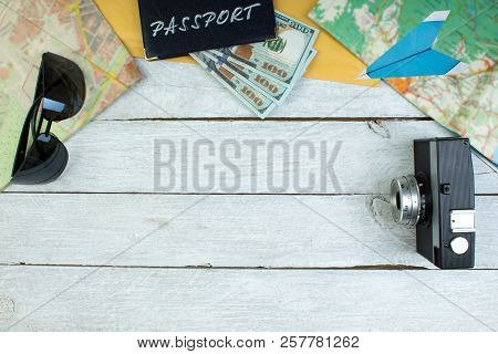 The Concept Of Travel And Recreation. Amera, Maps Geographic, Passport, Money, Bag, Glasses, Sunscre