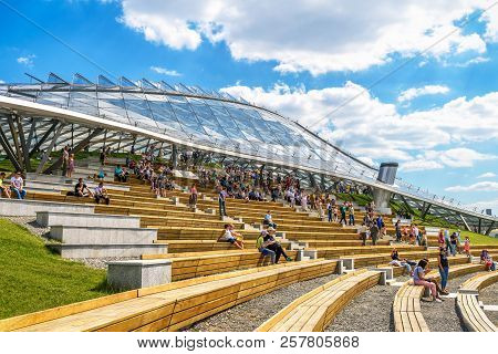 Moscow - June 16, 2018: People Visit The Modern Amphitheater With Glass Cupola In Zaryadye Park In S