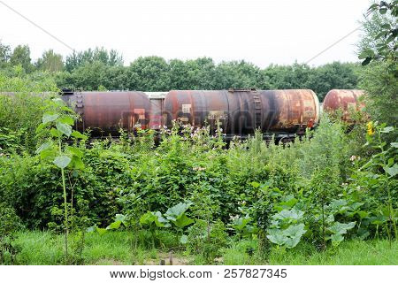 Dirty Rusty Cylindrical Iron Metal Railroad Tank Cars Capacious Cars For A Train On A Railway In Thi