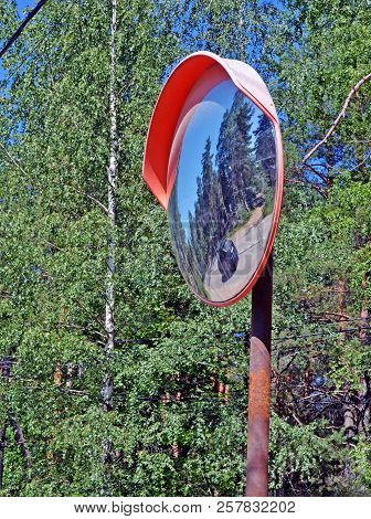 Security Mirror  Reflecting Twisting Highway In Rural Areas And The Car As Safety Metaphor On The Ro