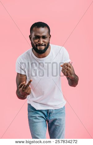 Portrait Of Young Afircan American Man Showing Middle Fingers Isolated On Pink