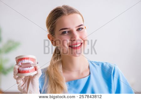 Young doctor nurse with dentures