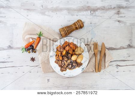 Beef meat stewed with potatoes-Traditional French cuisine Beef Bourguignon potatoes carrots in persillade