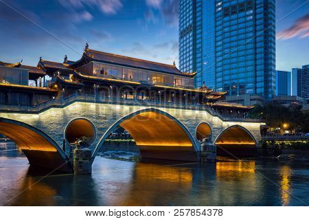 Famous landmark of Chengdu - Anshun bridge over Jin River illuminated at night, Chengdue, Sichuan , China