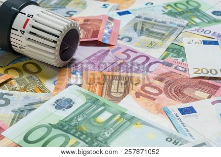 Heating Thermostat With Money, Expensive Heating Costs Concept.