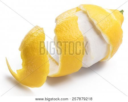 Peeled lemon and lemon zest on white background. Close-up.