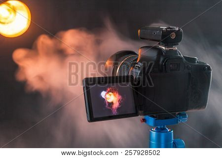 Photo Of The Camera On A Blue Tripod That Photographs In The Studio A Professional Lighting Device I