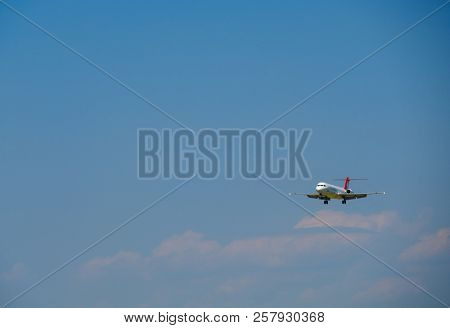 Zurich, Switzerland - July 19, 2018: Helvetic Swiss airlines airplane preparing for landing at day time in Zurich nternational airport