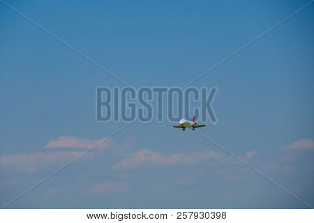 Zurich, Switzerland - July 19, 2018: Helvetic Swiss airlines airplane preparing for landing at day time in Zurich nternational airport