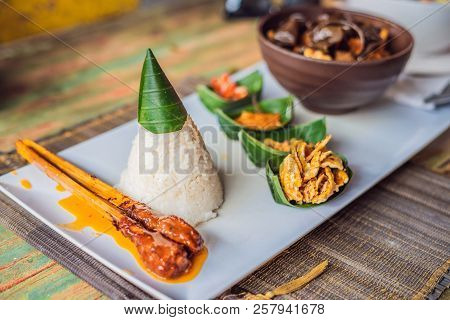 Lifestyle Food. A Dish Consisting Of Rice, Fried Fish With Wood Mushrooms And Different Kinds Of Sau