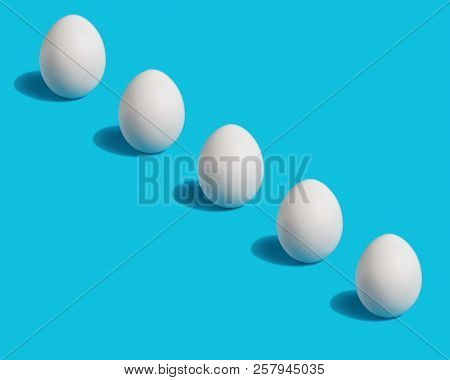 Egg. White Chicken Egg On Blue Background.